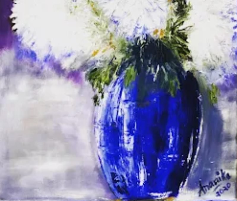 White blossoms in a cobalt-blue vase