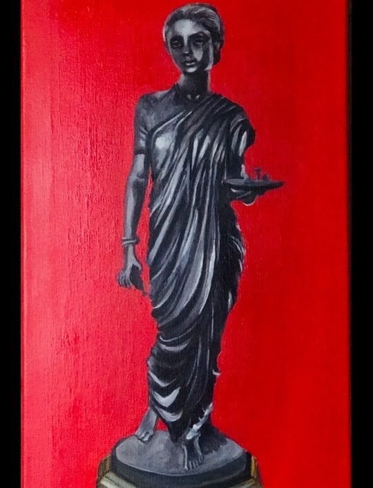 A dark bronze lamp-bearing figure against a red background