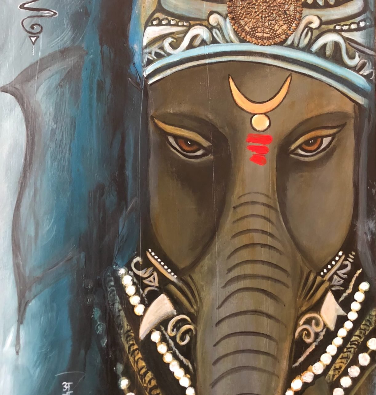 Ganesha in grey and silver tones with a crescent and tilak, beads around the trunk