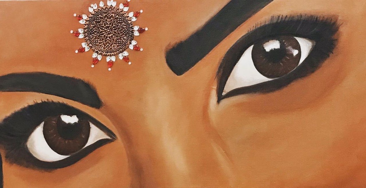 Eye study of a woman with kohl-lined eyes and a jewelled nose ornament at the brow