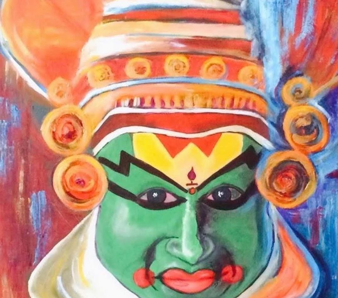Frontal Kathakali face in green with an ornate red and gold headdress